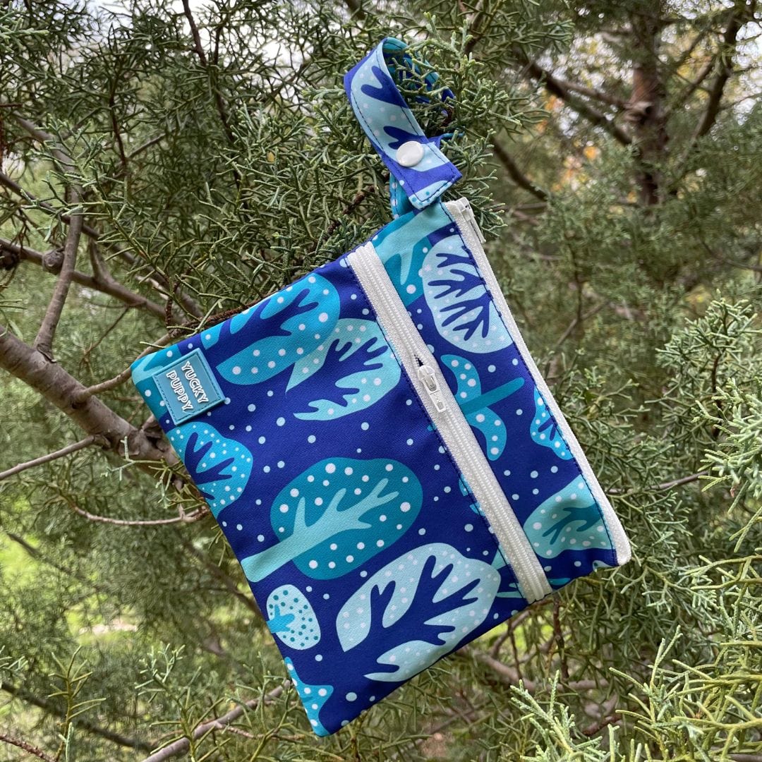 Dog poop outlet bags in trees